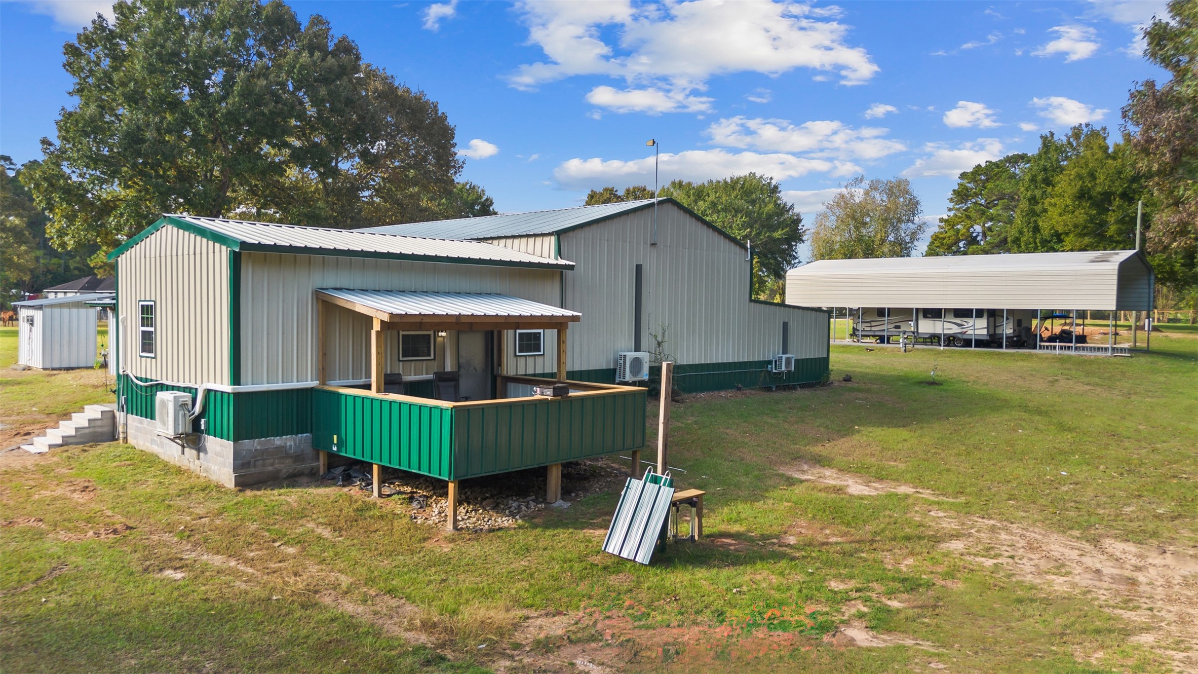 40 Olson Road New Waverly, TX 77358 - Photo 24 of 34 a view of a house with a yard porch and sitting area