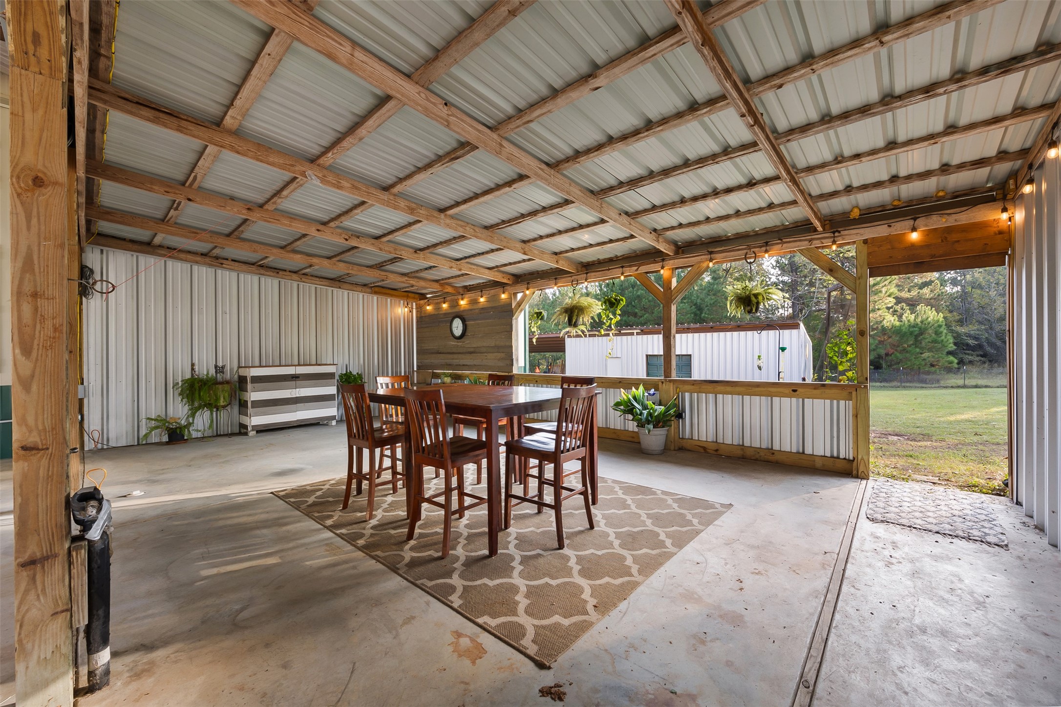 40 Olson Road New Waverly, TX 77358 - Photo 8 of 34 a view of a porch with furniture and a backyard
