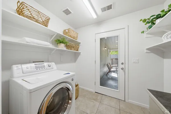 a view of storage and utility room with washer and dryer