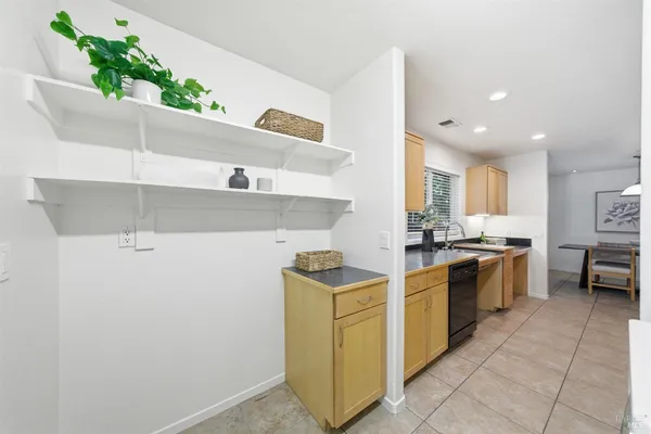 a kitchen with a stove and cabinets