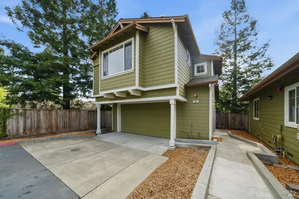 a view of a house with a backyard