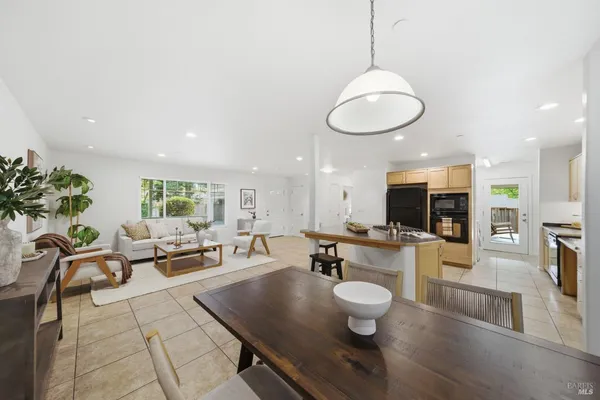 a living room with fireplace furniture and a wooden floor