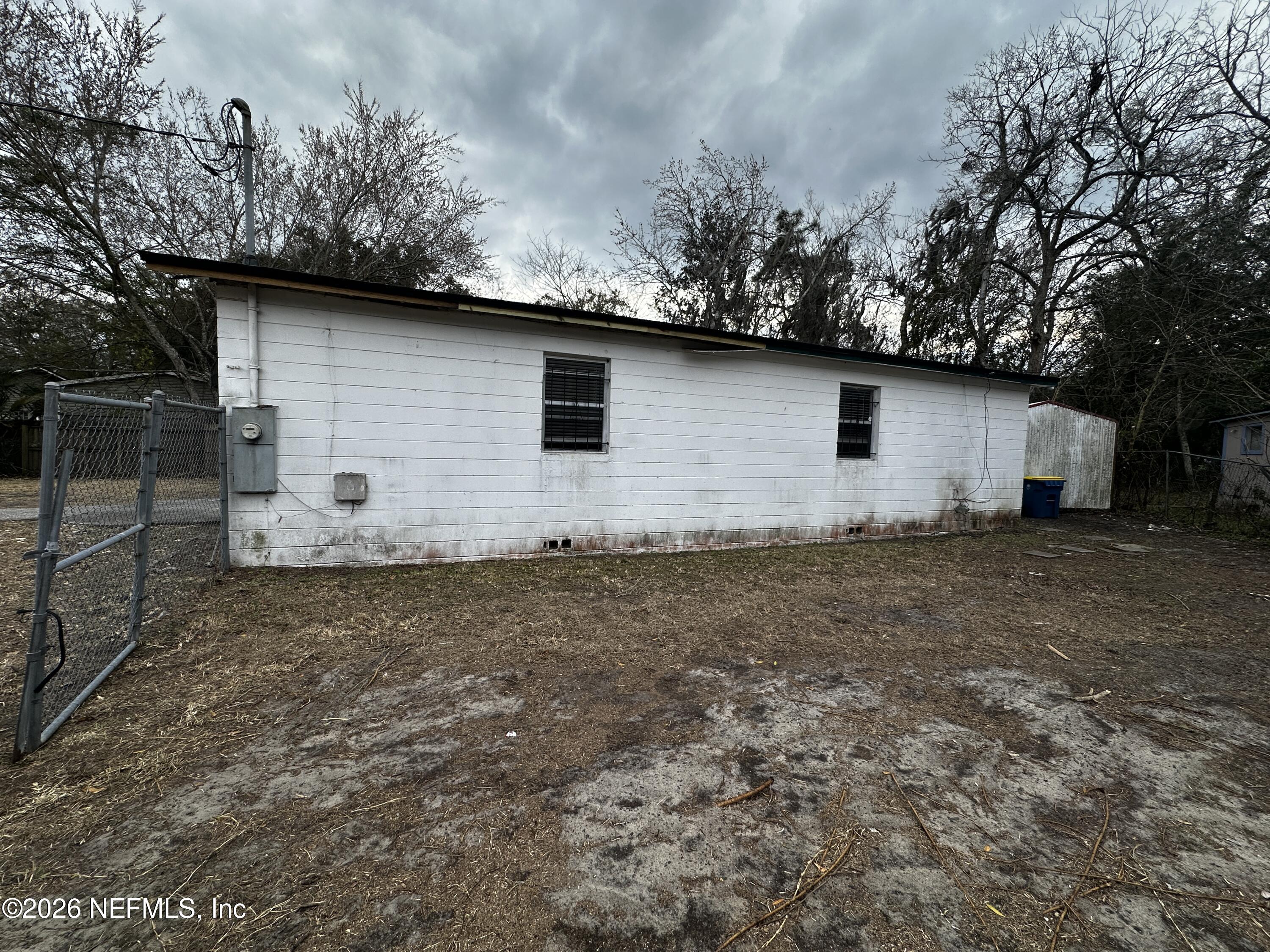2004 Benedict Road Jacksonville, FL 32209 - Photo 16 of 16 a backyard of a house with lots of green space