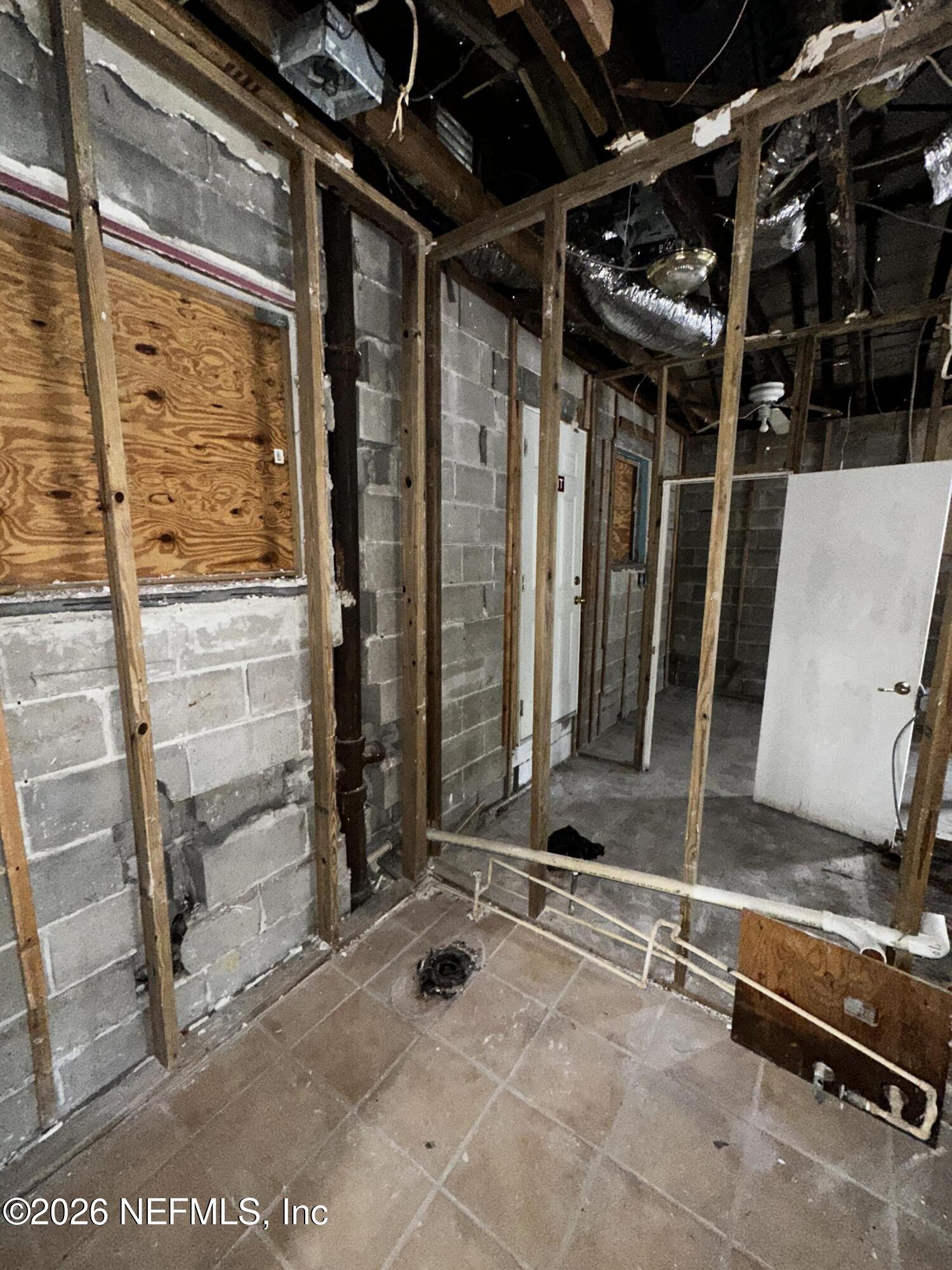 2004 Benedict Road Jacksonville, FL 32209 - Photo 9 of 16 a view of a room with wooden walls