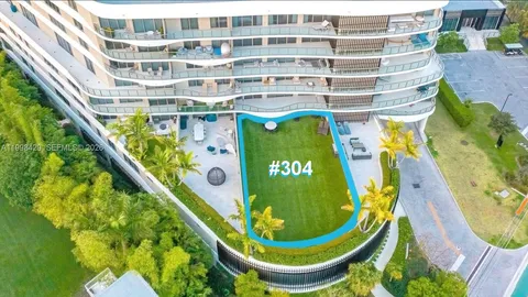 a view of a swimming pool with outdoor seating