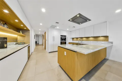 a kitchen with stainless steel appliances granite countertop a sink and cabinets