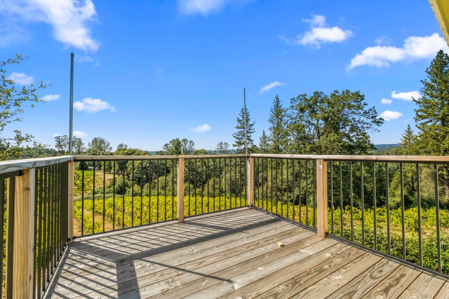 8221 Stoney Creek Road Somerset, CA 95684 - Photo 28 of 44 a view of a balcony with wooden floor