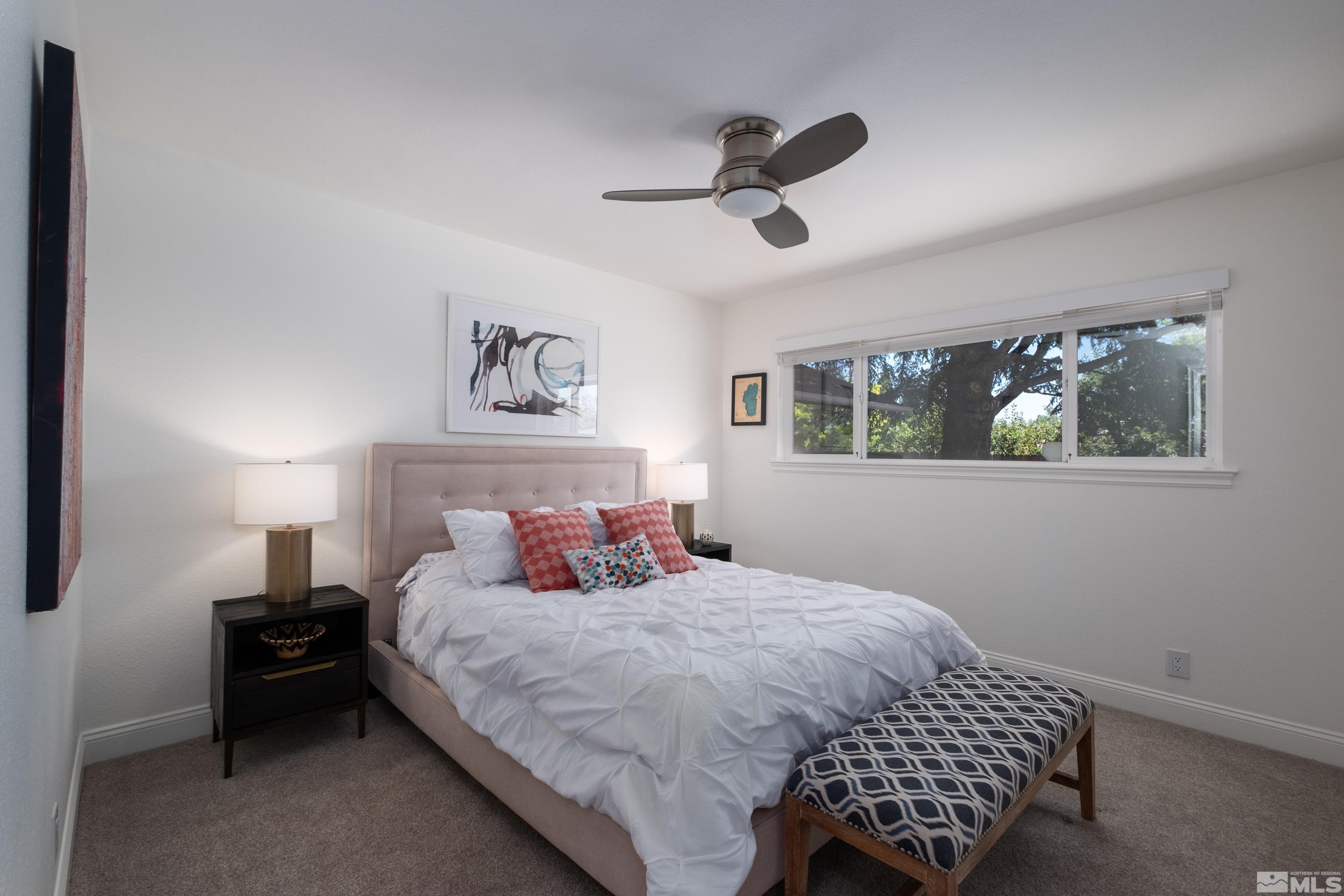 330 Chevy Chase Street Reno, NV 89509 - Photo 13 of 40 a bedroom with a bed and a painting on the wall