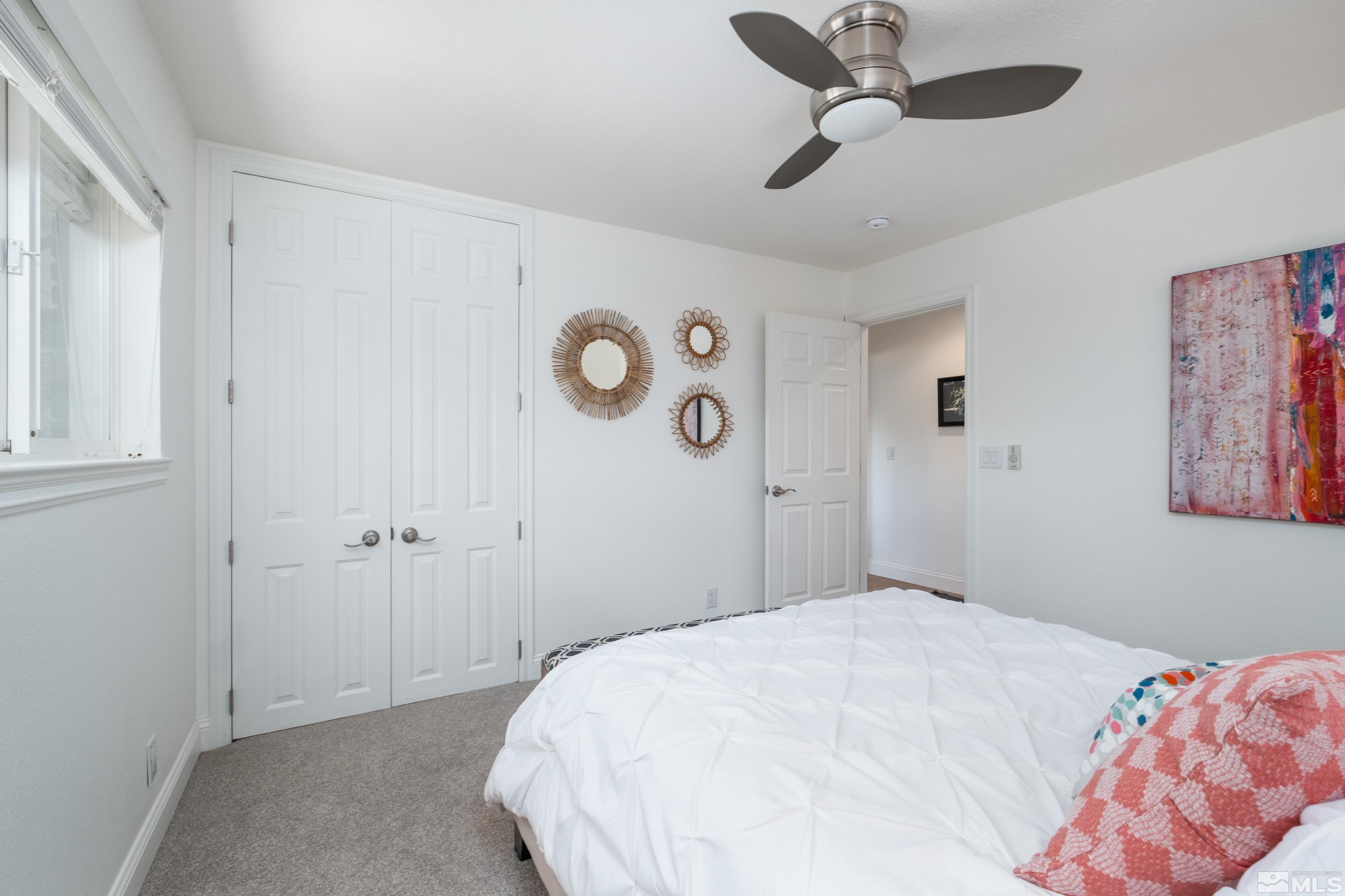 330 Chevy Chase Street Reno, NV 89509 - Photo 14 of 40 a bedroom with a bed and a chandelier