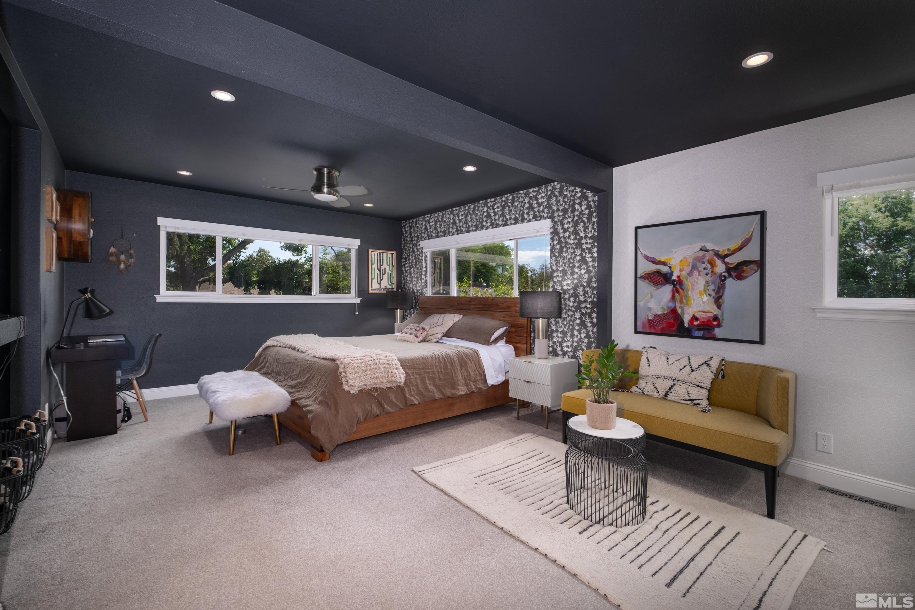330 Chevy Chase Street Reno, NV 89509 - Photo 15 of 40 a spacious bedroom with a bed couch and a large window