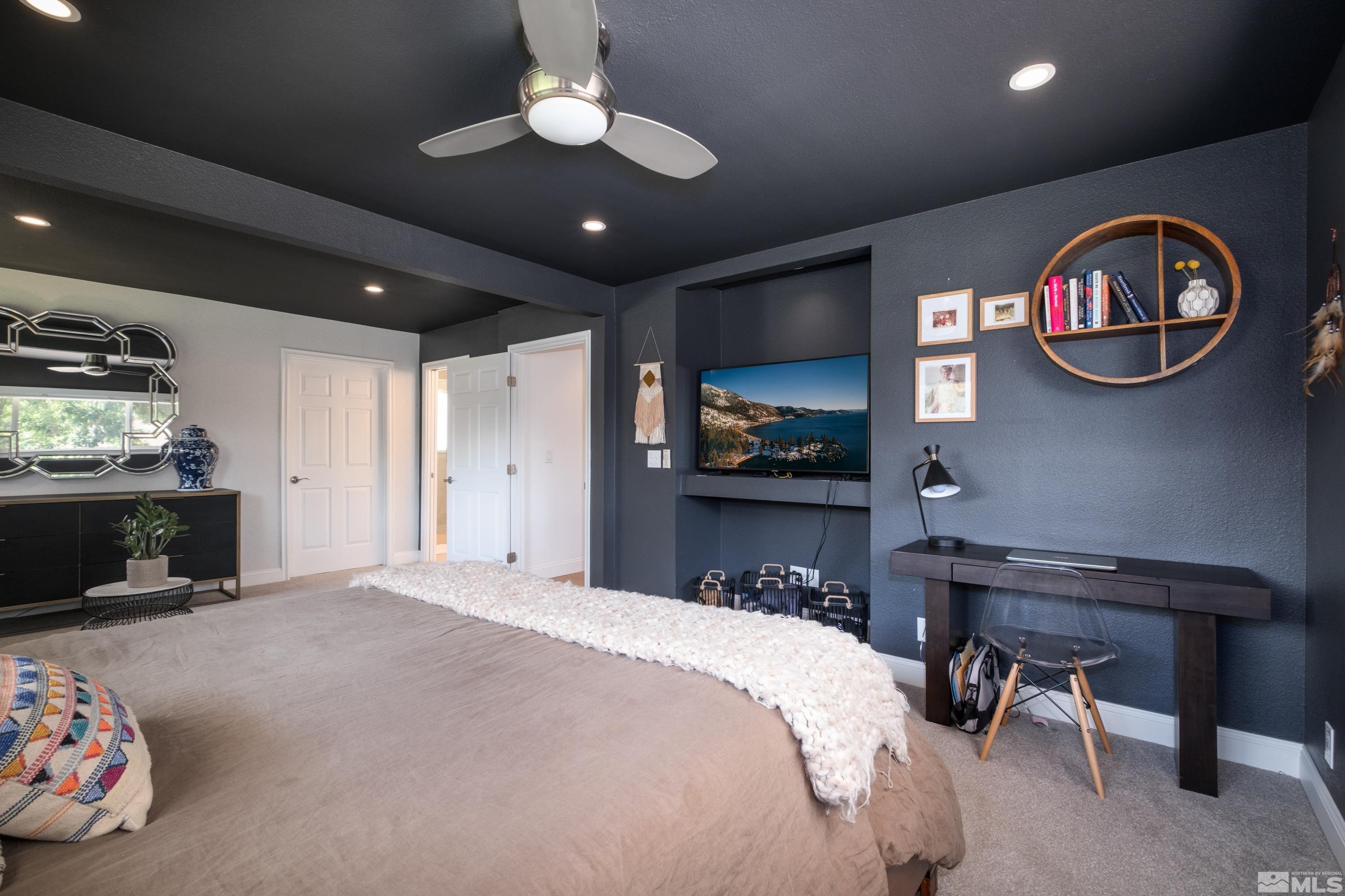 330 Chevy Chase Street Reno, NV 89509 - Photo 16 of 40 a bedroom with a bed and a chandelier