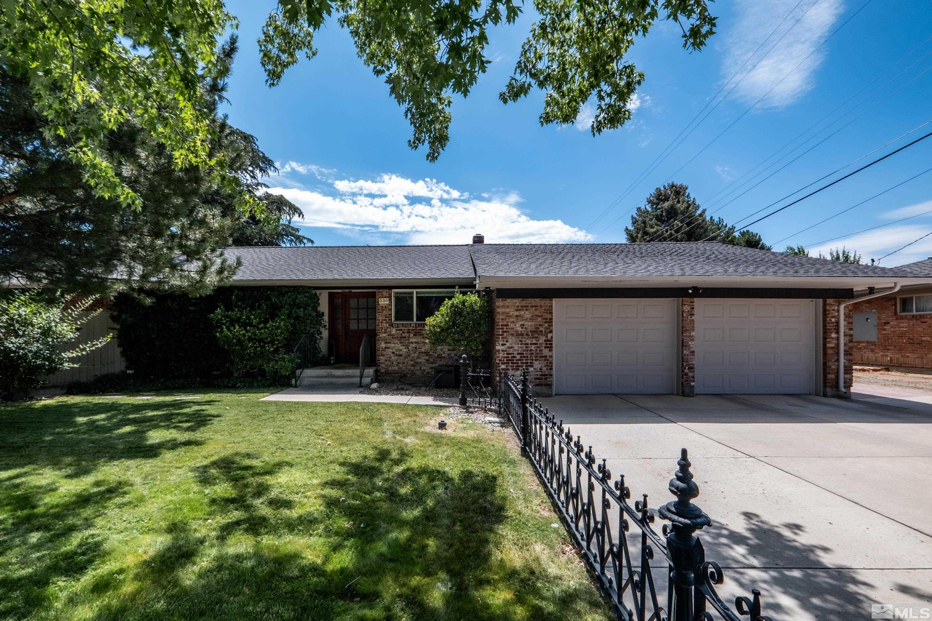 330 Chevy Chase Street Reno, NV 89509 - Photo 2 of 40 a front view of house with yard and garage