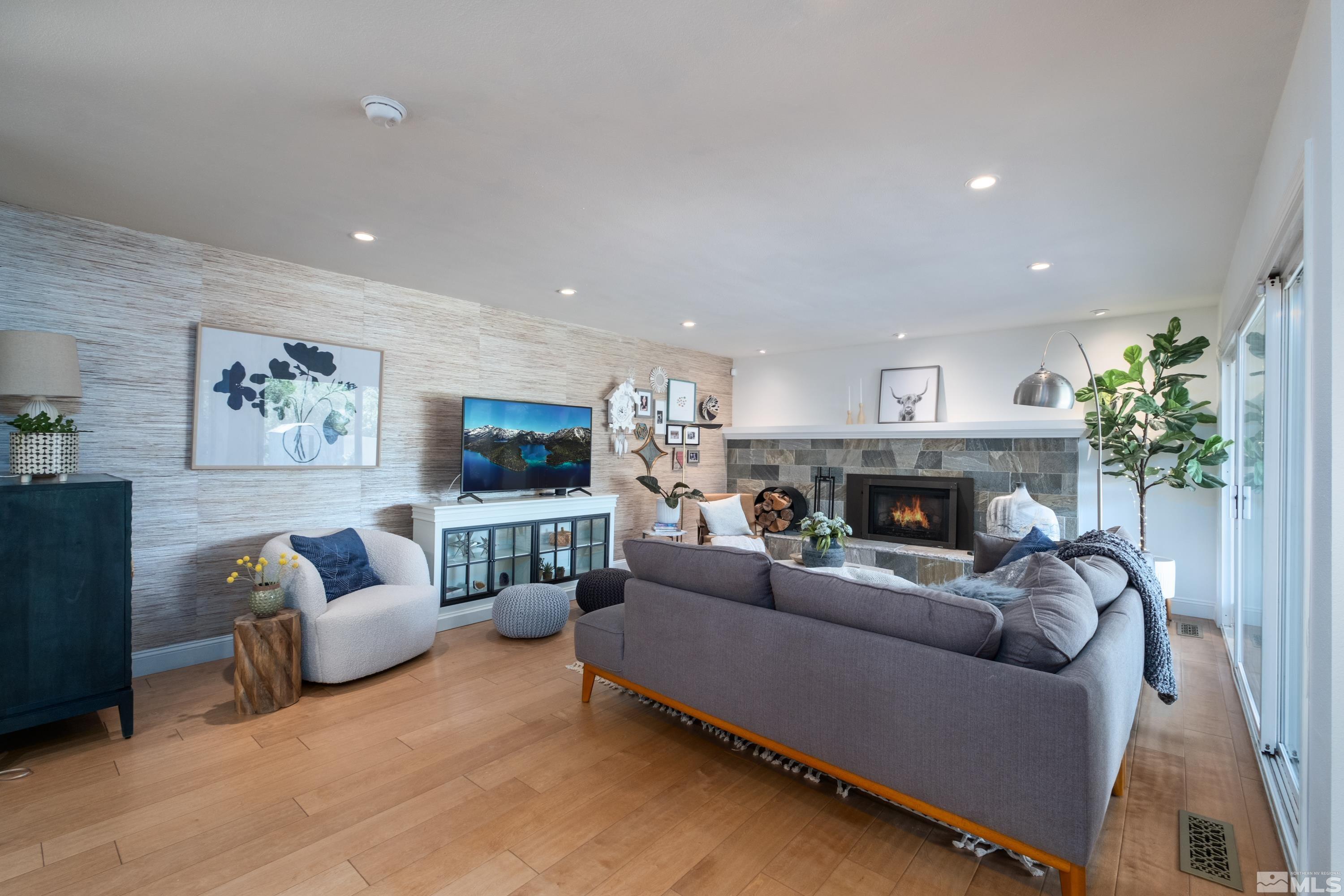 330 Chevy Chase Street Reno, NV 89509 - Photo 3 of 40 a living room with furniture and a fireplace