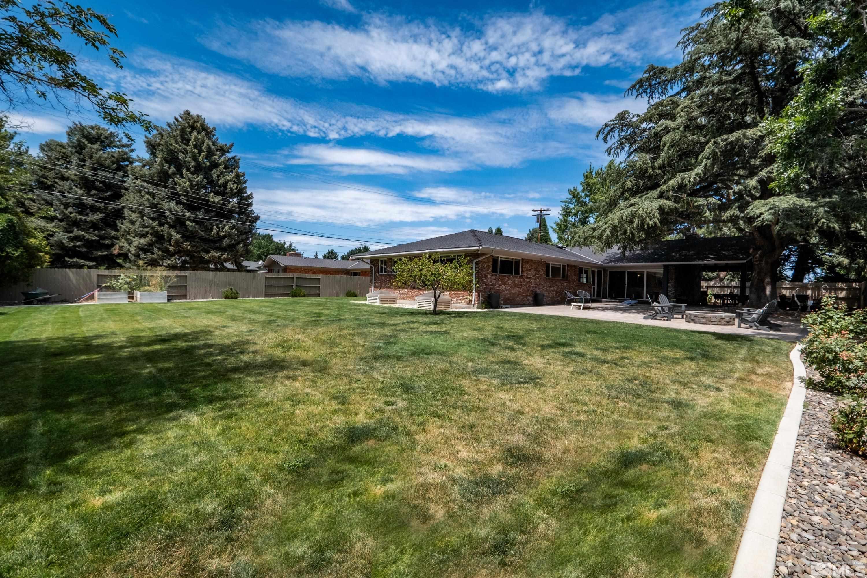 330 Chevy Chase Street Reno, NV 89509 - Photo 32 of 40 a front view of a house with a yard