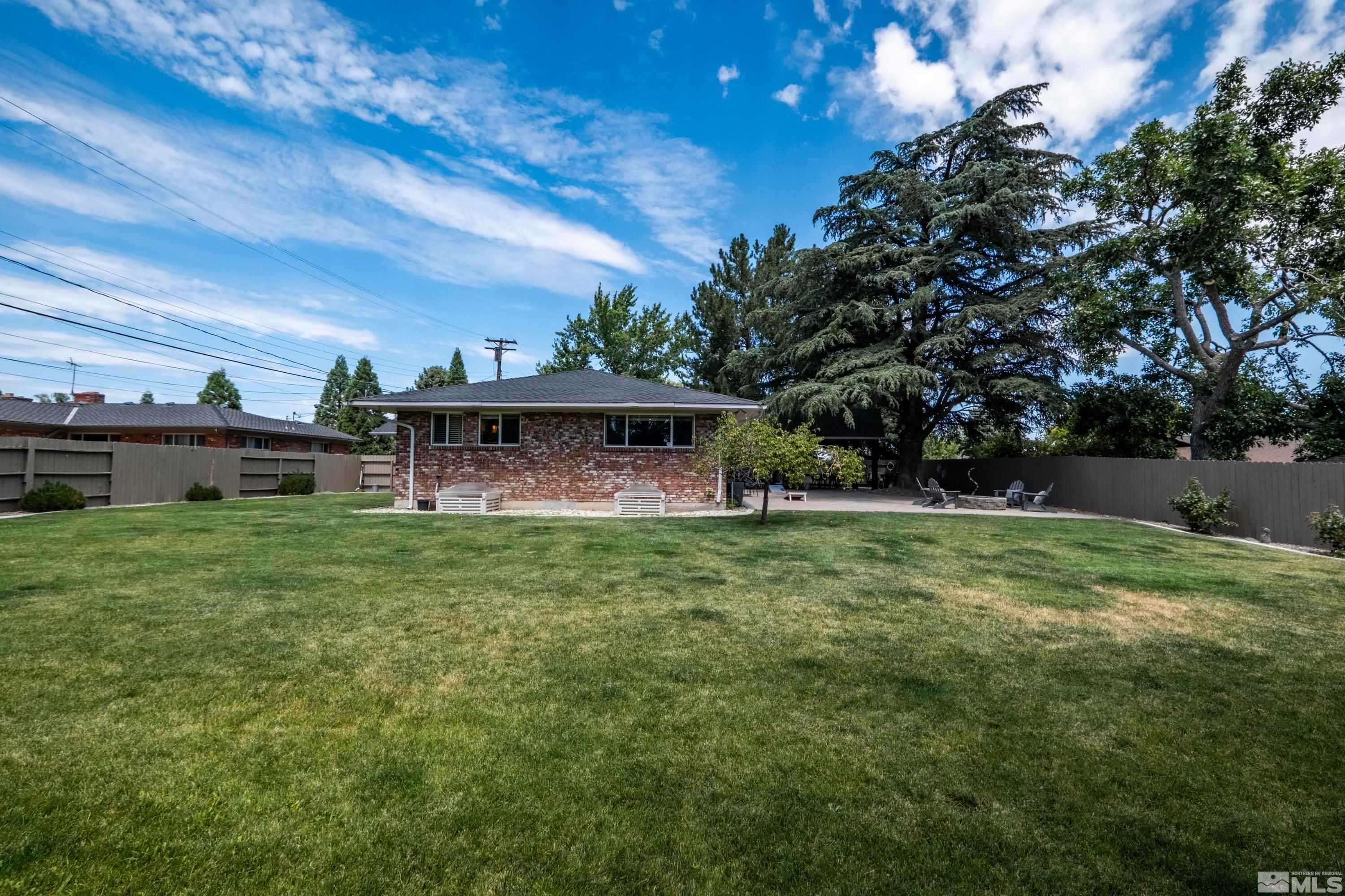 330 Chevy Chase Street Reno, NV 89509 - Photo 33 of 40 a view of a backyard with large trees
