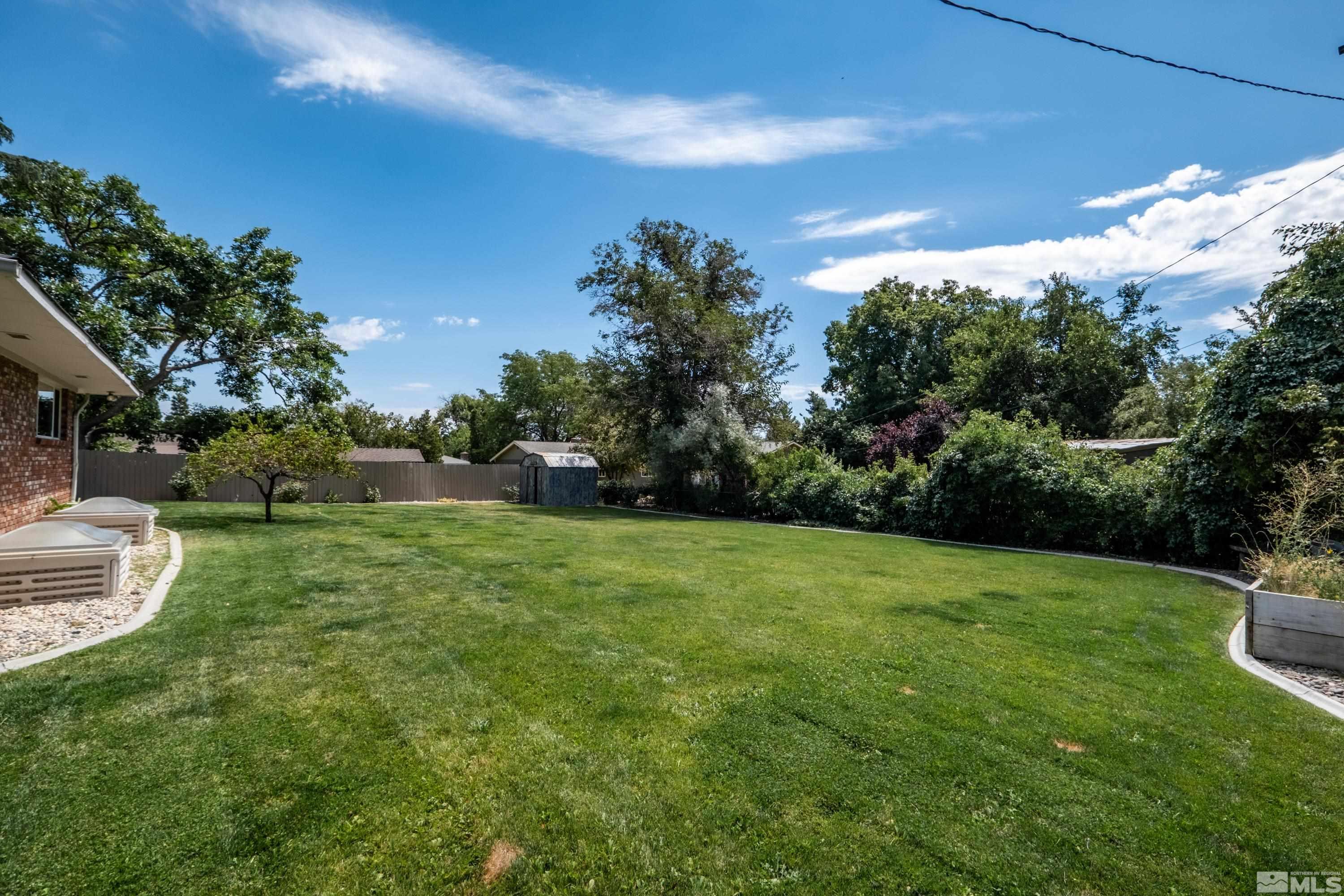 330 Chevy Chase Street Reno, NV 89509 - Photo 35 of 40 a view of a field of grass and trees