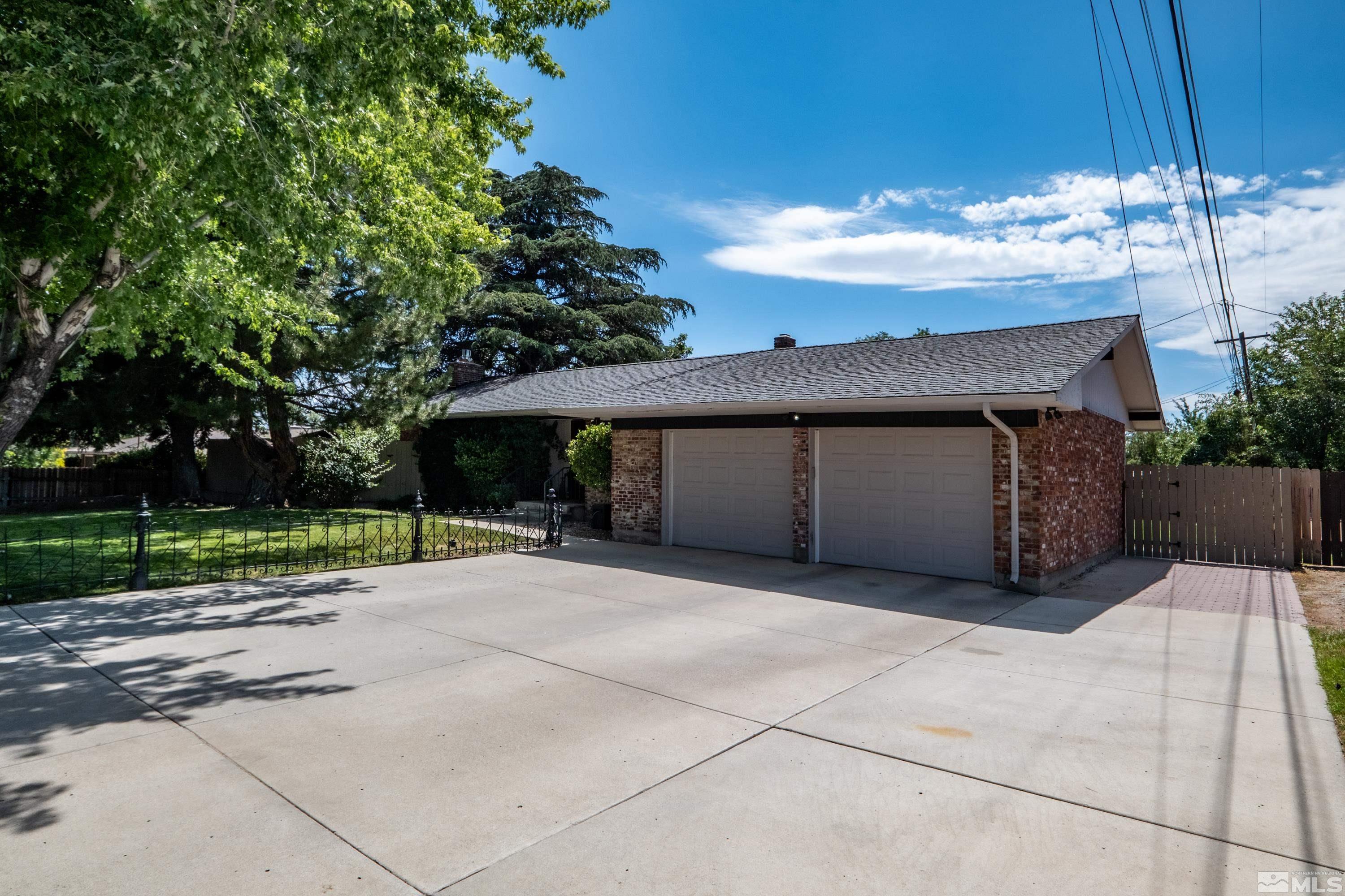 330 Chevy Chase Street Reno, NV 89509 - Photo 39 of 40 a view of a house with a yard and garage