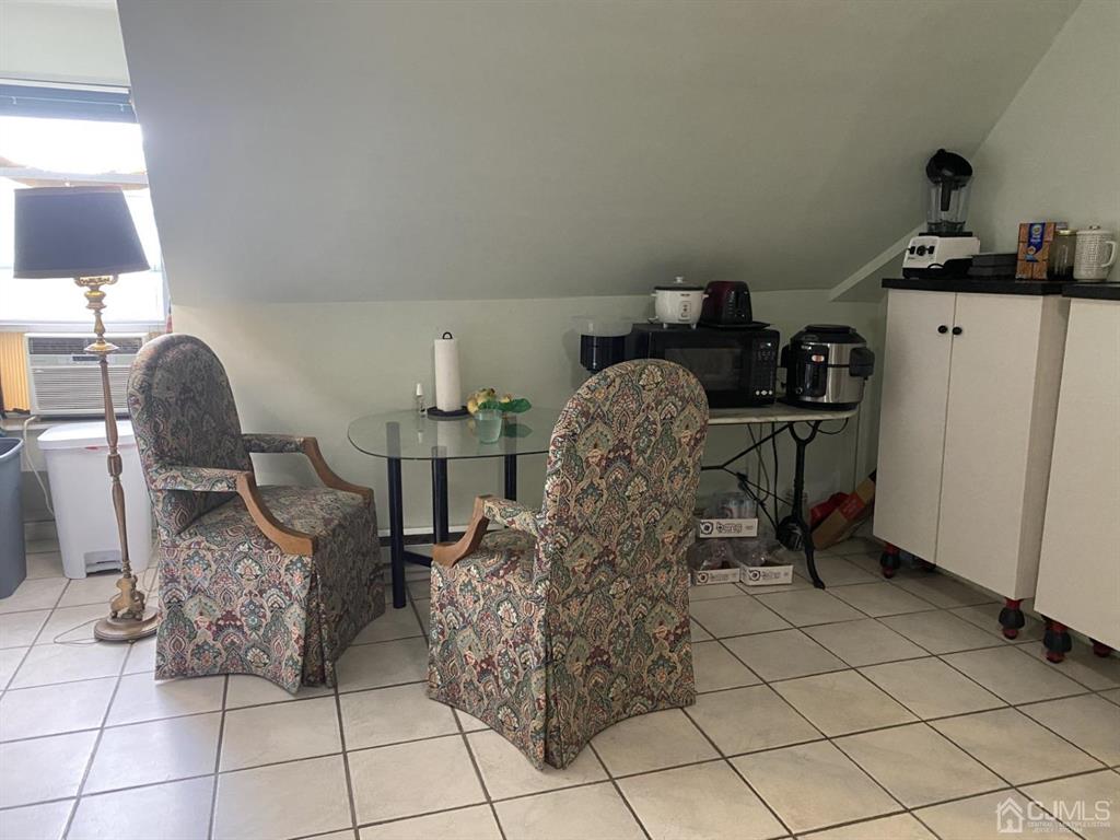 531 West 8th Street, Unit D Plainfield, NJ 07060 - Photo 4 of 10 a living room with furniture and a window