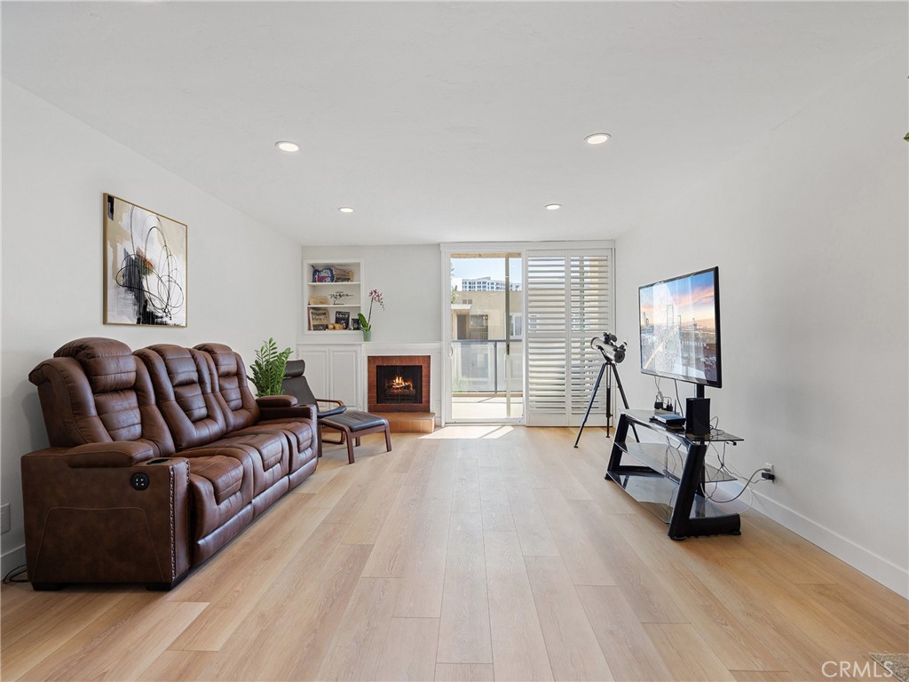 1 3rd Place, Unit 2 Long Beach, CA 90802 - Photo 7 of 39 a living room with furniture and a fireplace