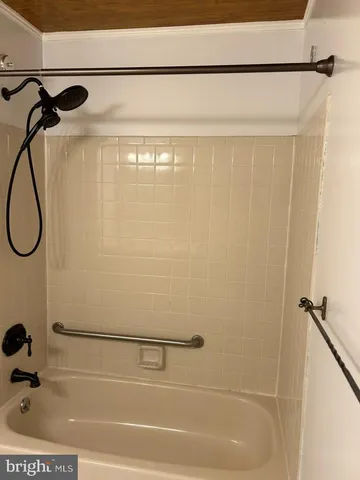 a bathroom with a shower and a shower