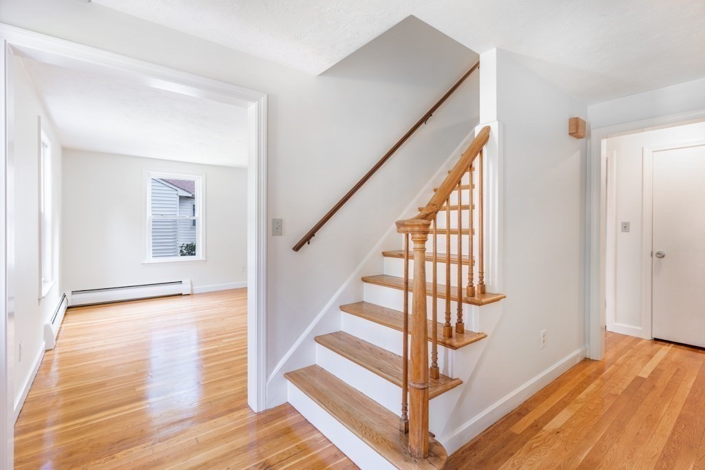 8 Michael Road Wakefield, MA 01880 - Photo 12 of 35 a view of entryway with wooden floor and stairs