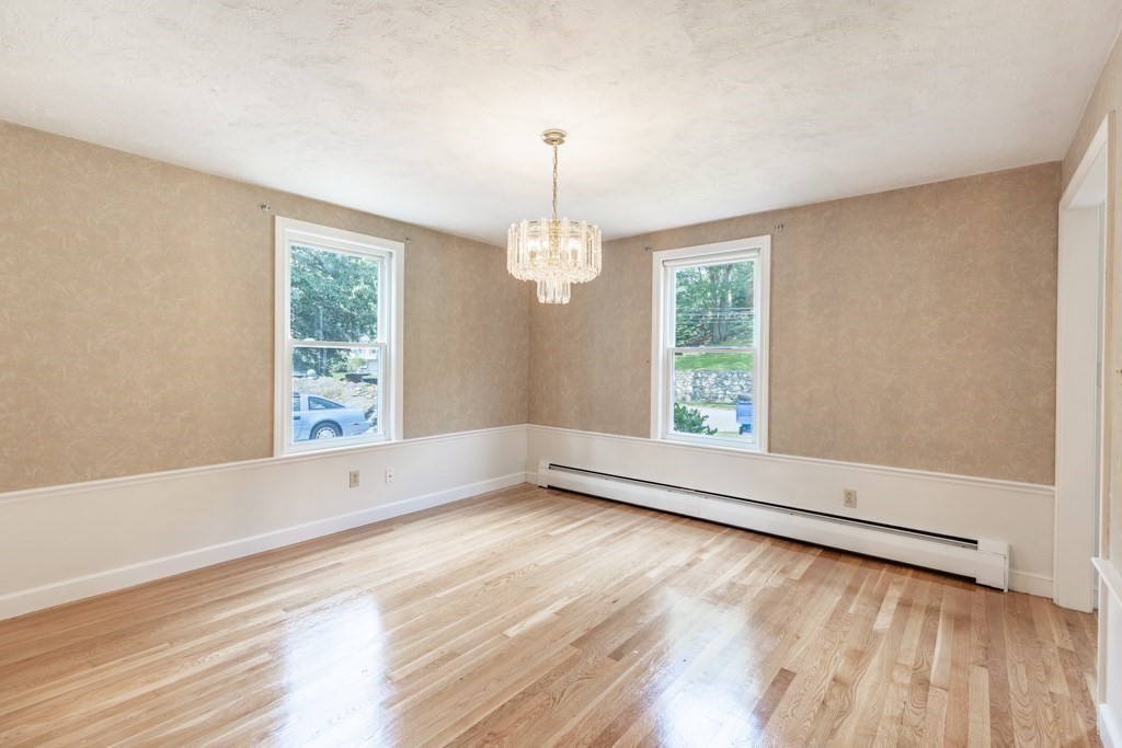 8 Michael Road Wakefield, MA 01880 - Photo 13 of 35 a view of an empty room with wooden floor and a window