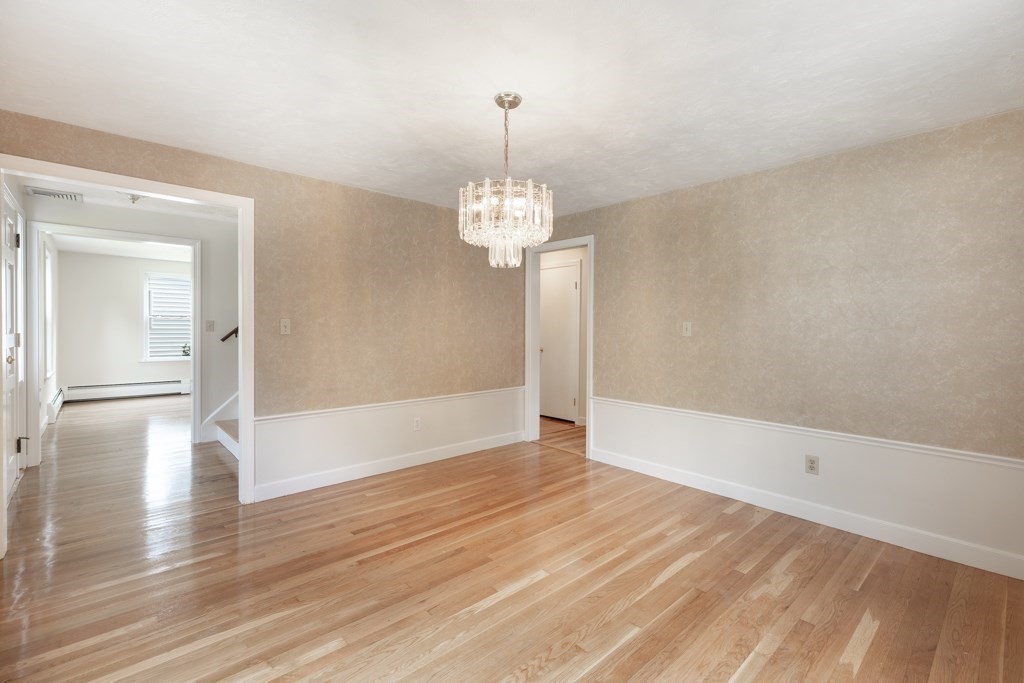 8 Michael Road Wakefield, MA 01880 - Photo 14 of 35 a view of a room with wooden floor and brick walls