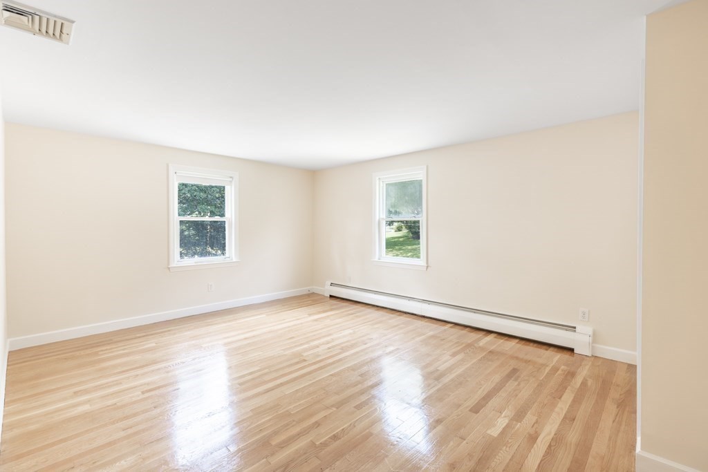 8 Michael Road Wakefield, MA 01880 - Photo 15 of 35 an empty room with wooden floor and windows
