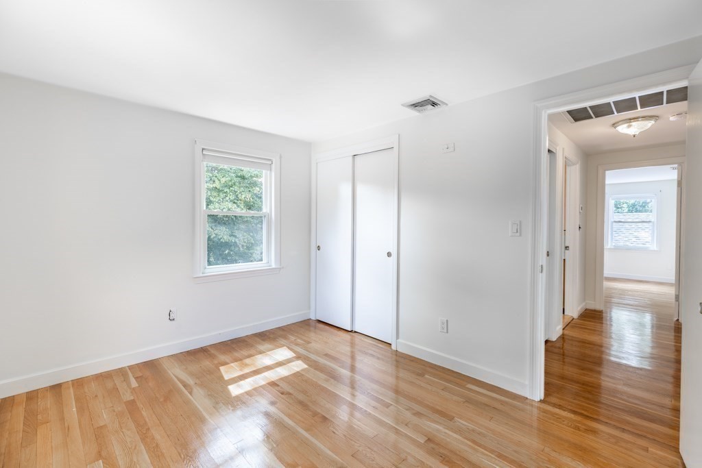8 Michael Road Wakefield, MA 01880 - Photo 20 of 35 a view of empty room with wooden floor and fan
