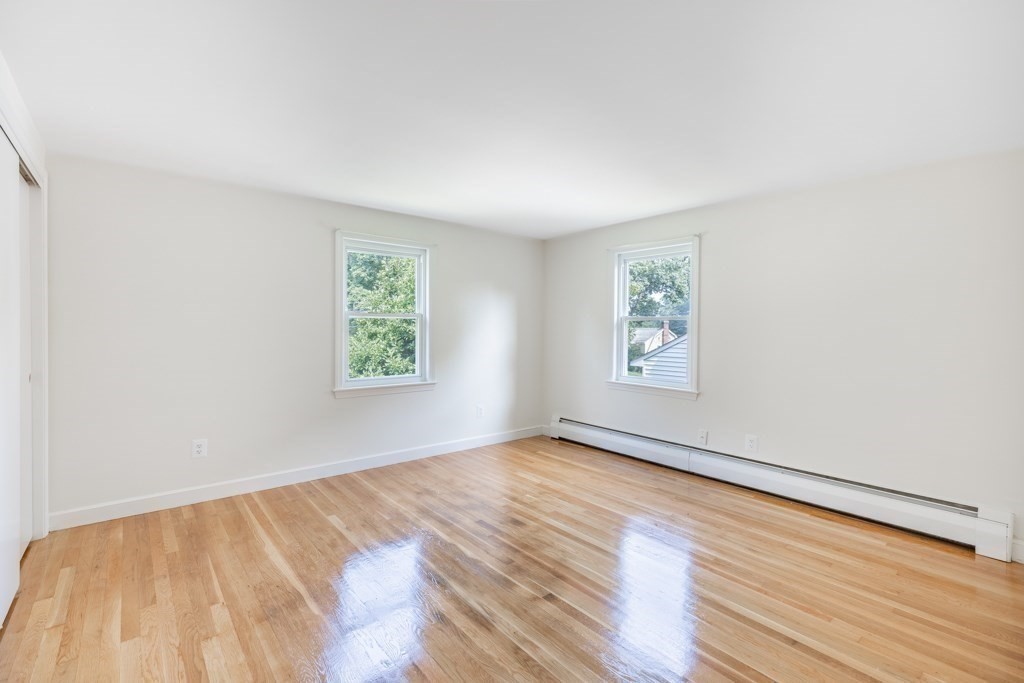 8 Michael Road Wakefield, MA 01880 - Photo 21 of 35 wooden floor in an empty room with a window