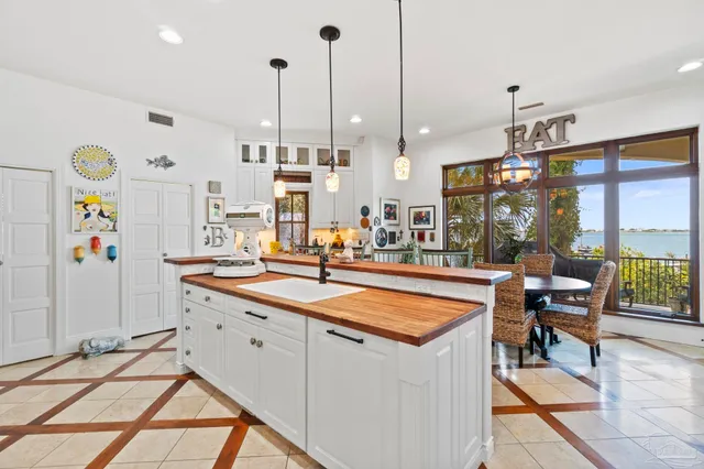 a open kitchen with stainless steel appliances granite countertop a sink and a refrigerator