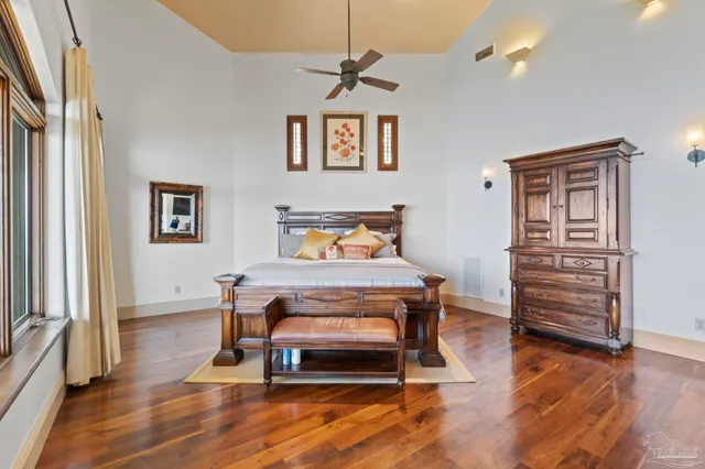 a bedroom with furniture and wooden floor