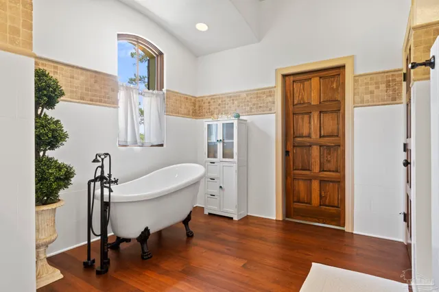 a view of a livingroom with furniture and hardwood floor