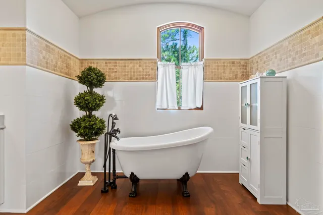 a balcony with furniture and a potted plant