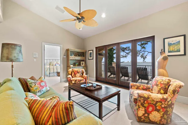 a bedroom with a bed and ceiling fan