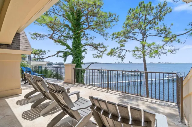 a view of a chair and tables in the balcony