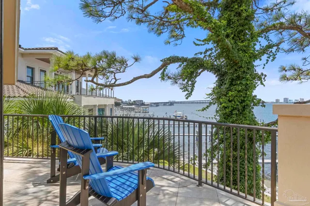 a balcony view with couple of chairs