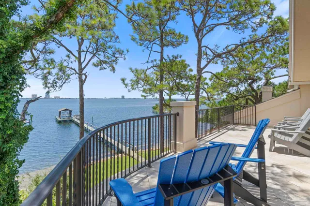 a view of a balcony with furniture