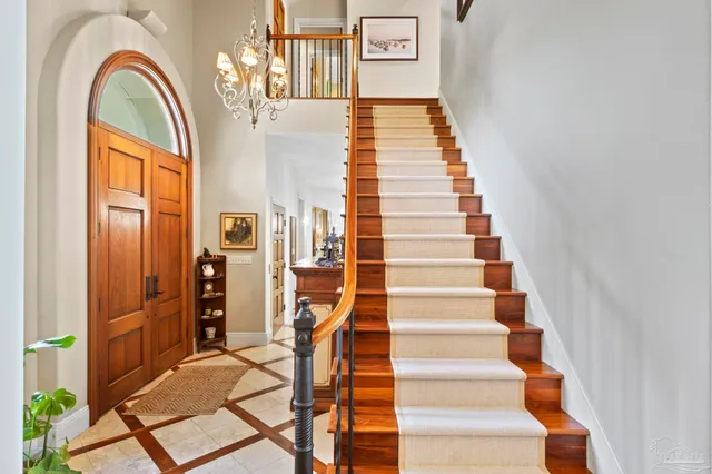 a view of entryway with wooden floor and windows