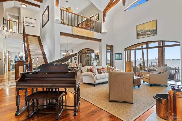 a living room with furniture and a painting on the wall