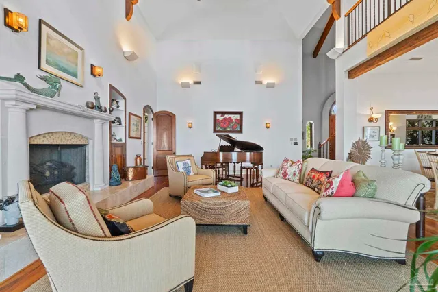 a living room with fireplace furniture and a fireplace
