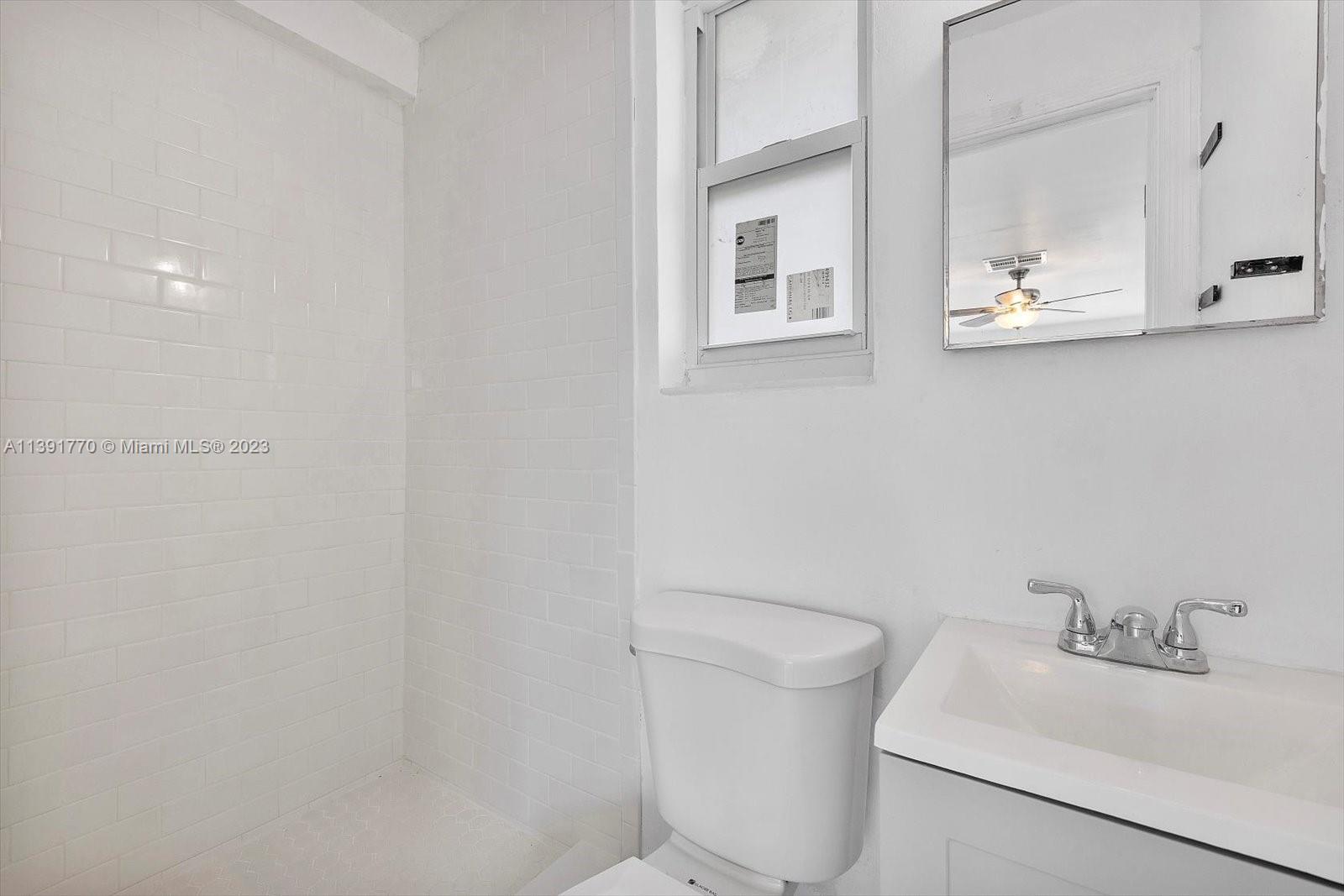 6110 Southwest 20th Street Miami, FL 33155 - Photo 17 of 29 a bathroom with a sink and a toilet