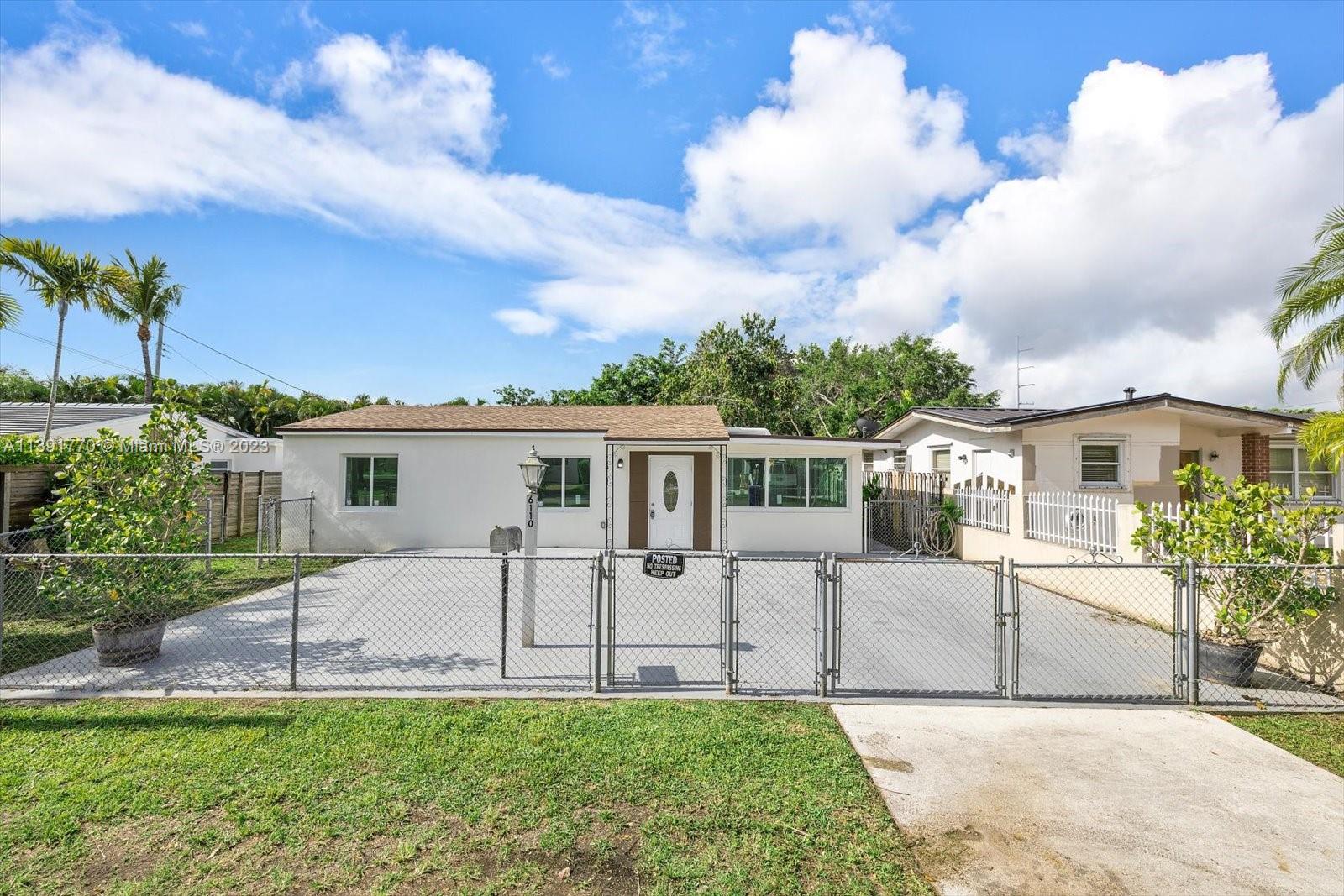6110 Southwest 20th Street Miami, FL 33155 - Photo 2 of 29 a view of a house with a backyard