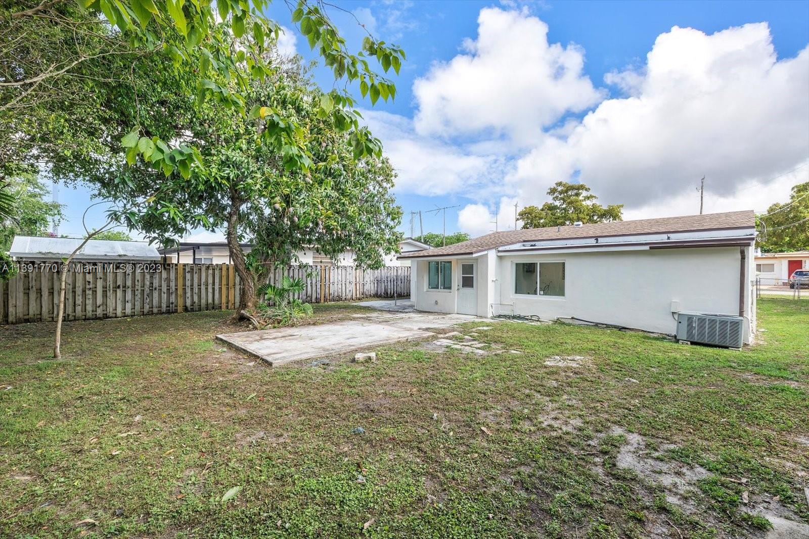6110 Southwest 20th Street Miami, FL 33155 - Photo 25 of 29 a view of a house with a yard