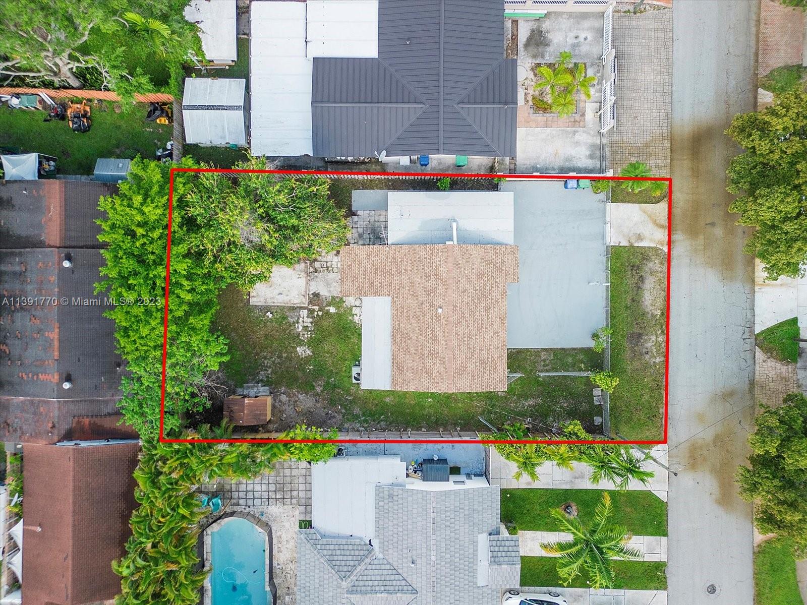 6110 Southwest 20th Street Miami, FL 33155 - Photo 3 of 29 an aerial view of a house with a yard and garden