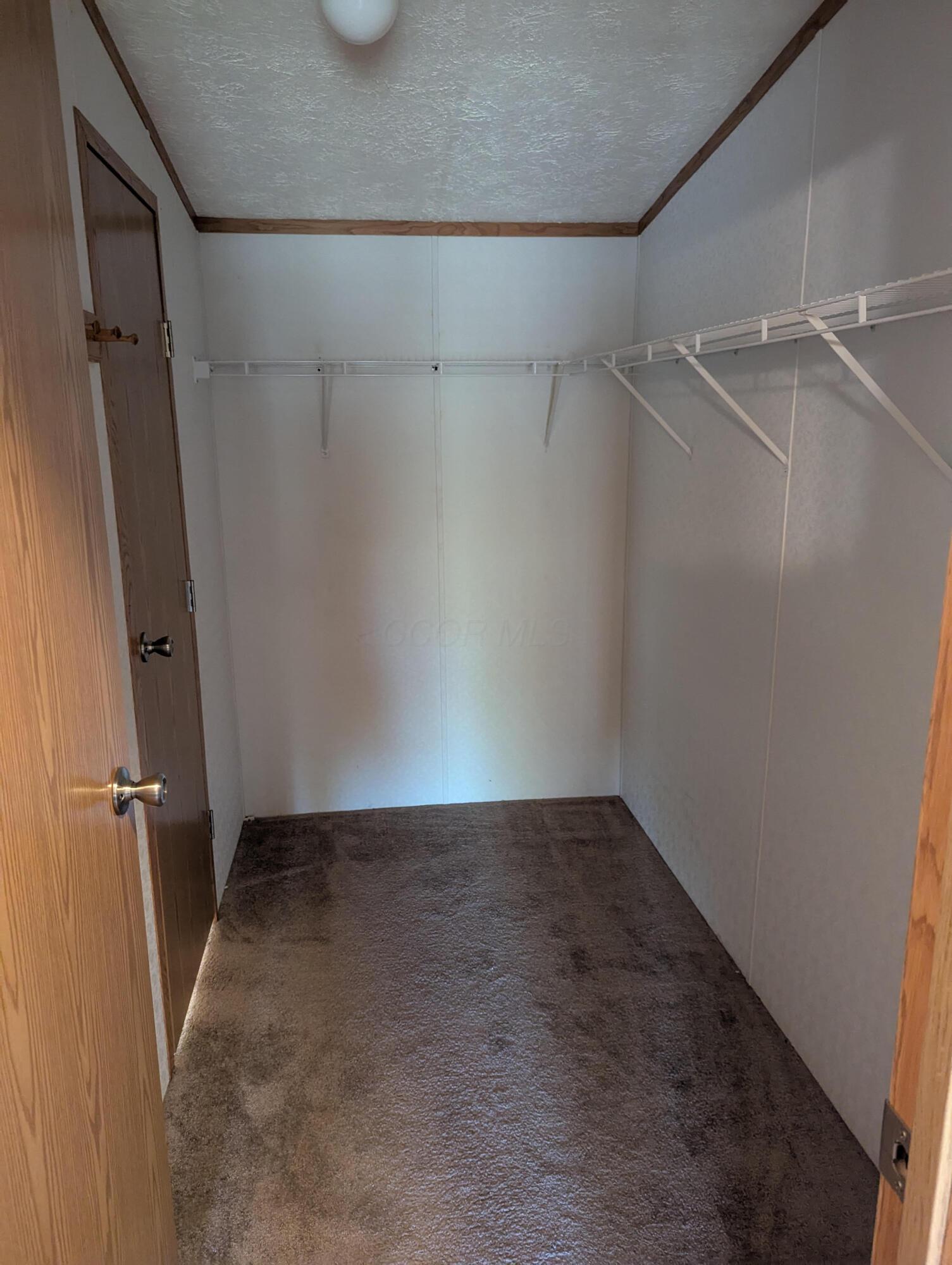 9965 Catt Road Newark, OH 43055 - Photo 9 of 11 MASTER BEDROOM CLOSET