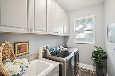 a kitchen that has a sink and a stove