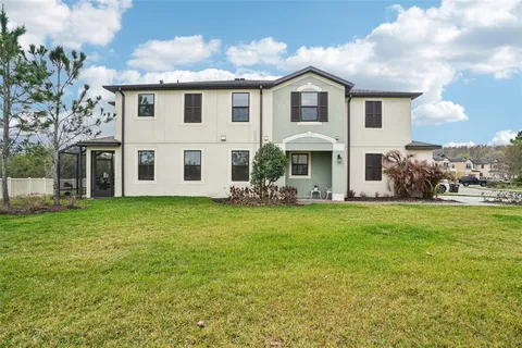 a front view of house with yard and green space