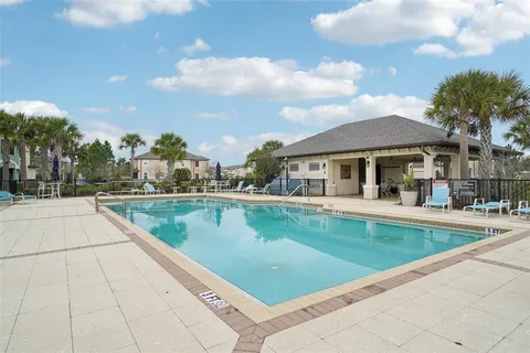a view of a patio with table and chairs