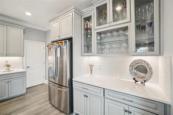 a kitchen with appliances cabinets and a counter top space